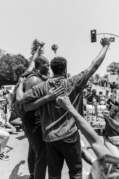 Two men shoulder to shoulder